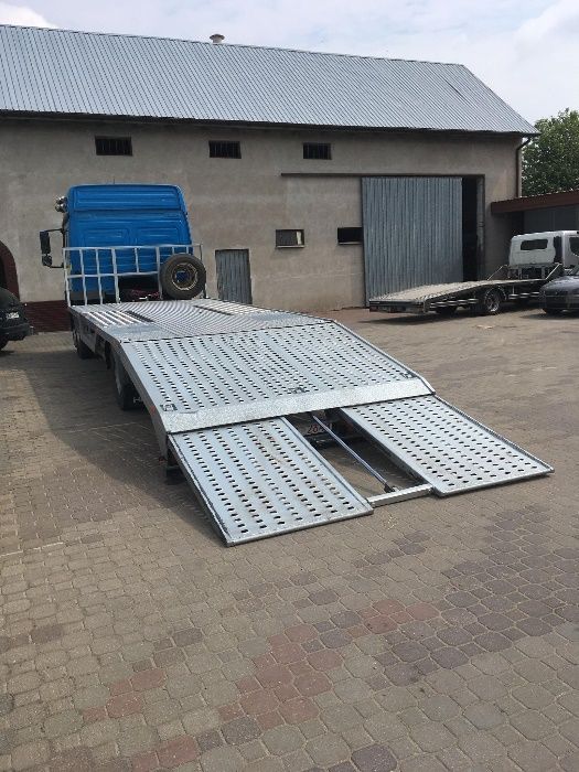 POMOC DROGOWA Holowanie Transport busów ciągników AUTOLAWETA