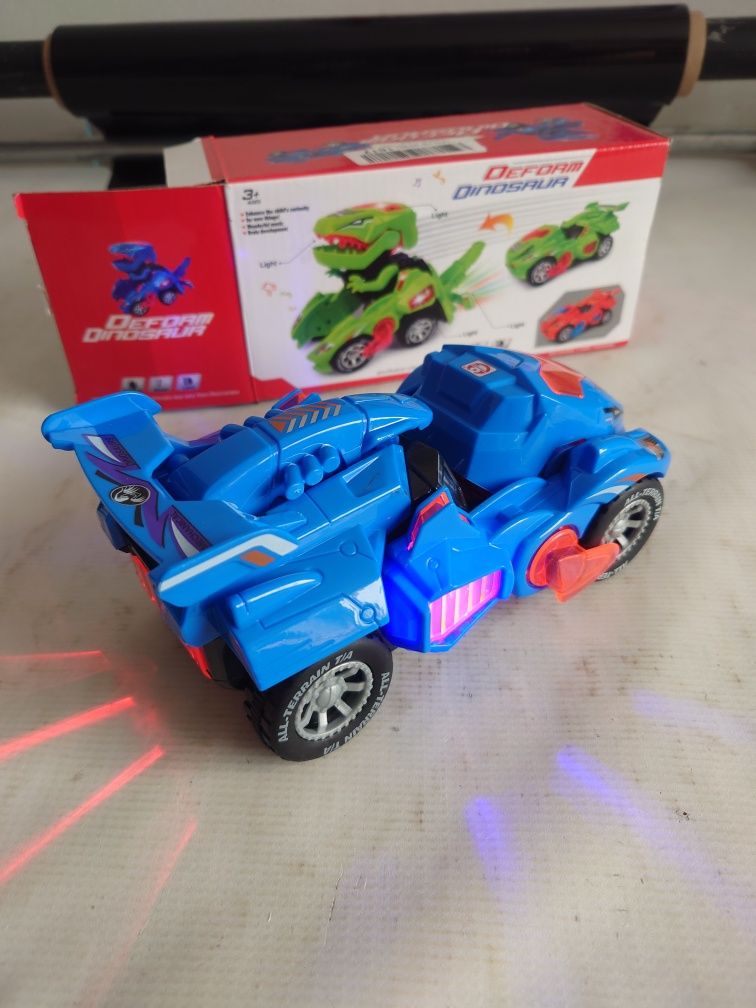 Samochód Dinozaur autko świecące na baterie Transformer wiek 3+
