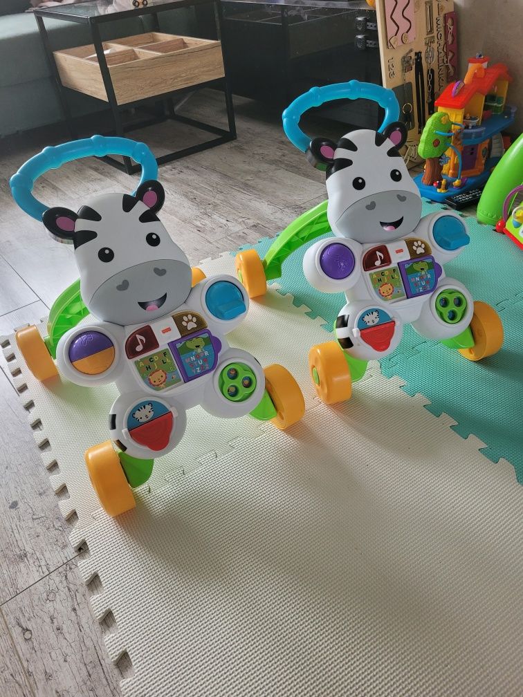 Sprzedam dwa pchacze-chodziki FISHER PRICE język polski