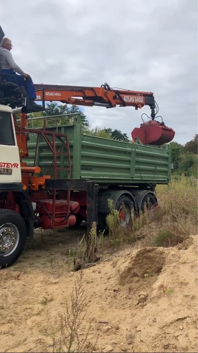 Załadunek mechaniczny gruzu, ziemi oraz transport