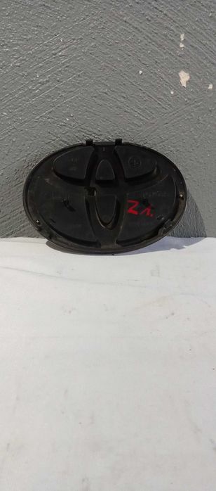 Emblemat Logo Znaczek Toyota Yaris II Emblemat Zderzaka 753.11-000.30