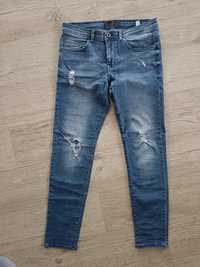 Spodnie jeansowe jeansy z rozdarciami Reserved r. 30 dl. 32 S M