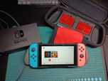 Nintendo Switch + pokrowiec + trzymadełko