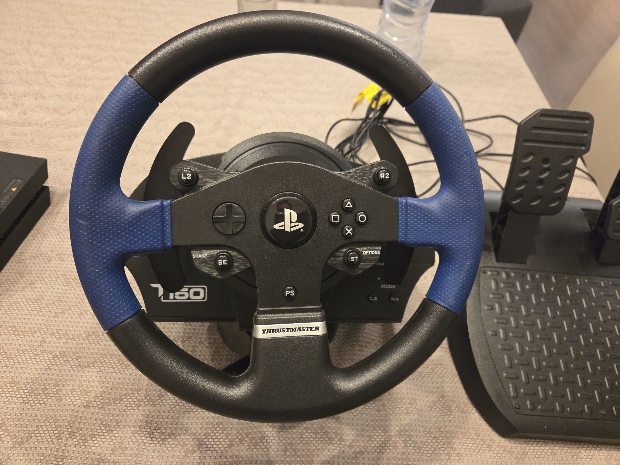 Vendo ps4 com 2 comandos  e volante thrustmaster T 150 como novo