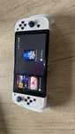 Nintendo Switch OLED + grip + karta SD 128 Samsung  + etui
