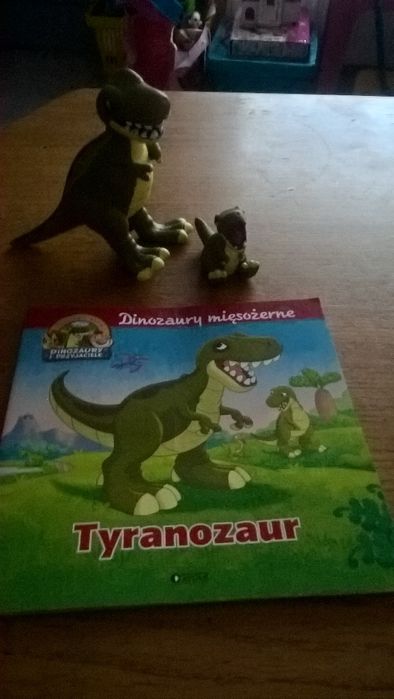 książa ATLASA z figurką dinozałra