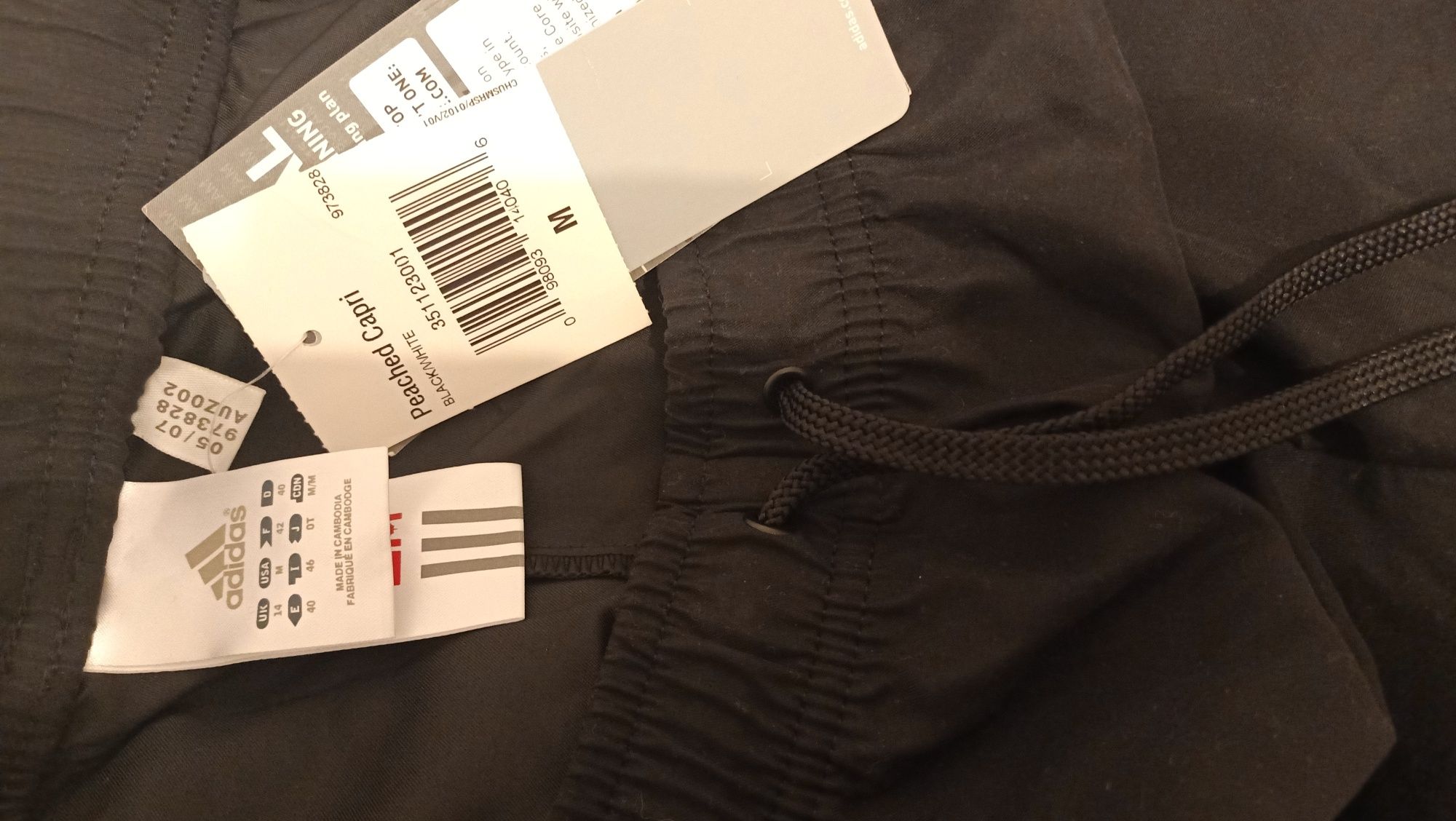 Nowe damskie spodnie dresowe treningowe Adidas, M, 3/4, kolor czarny
