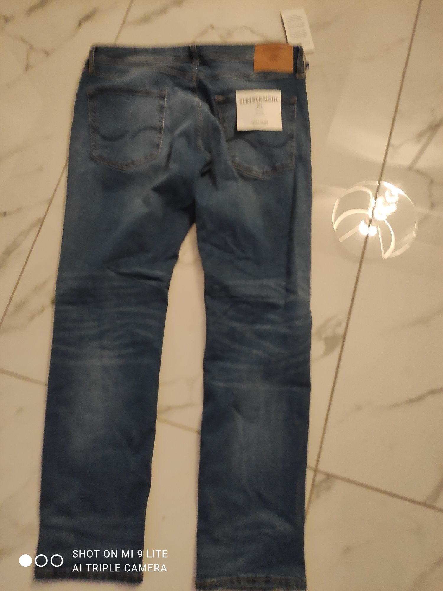 Spodnie jeans 34