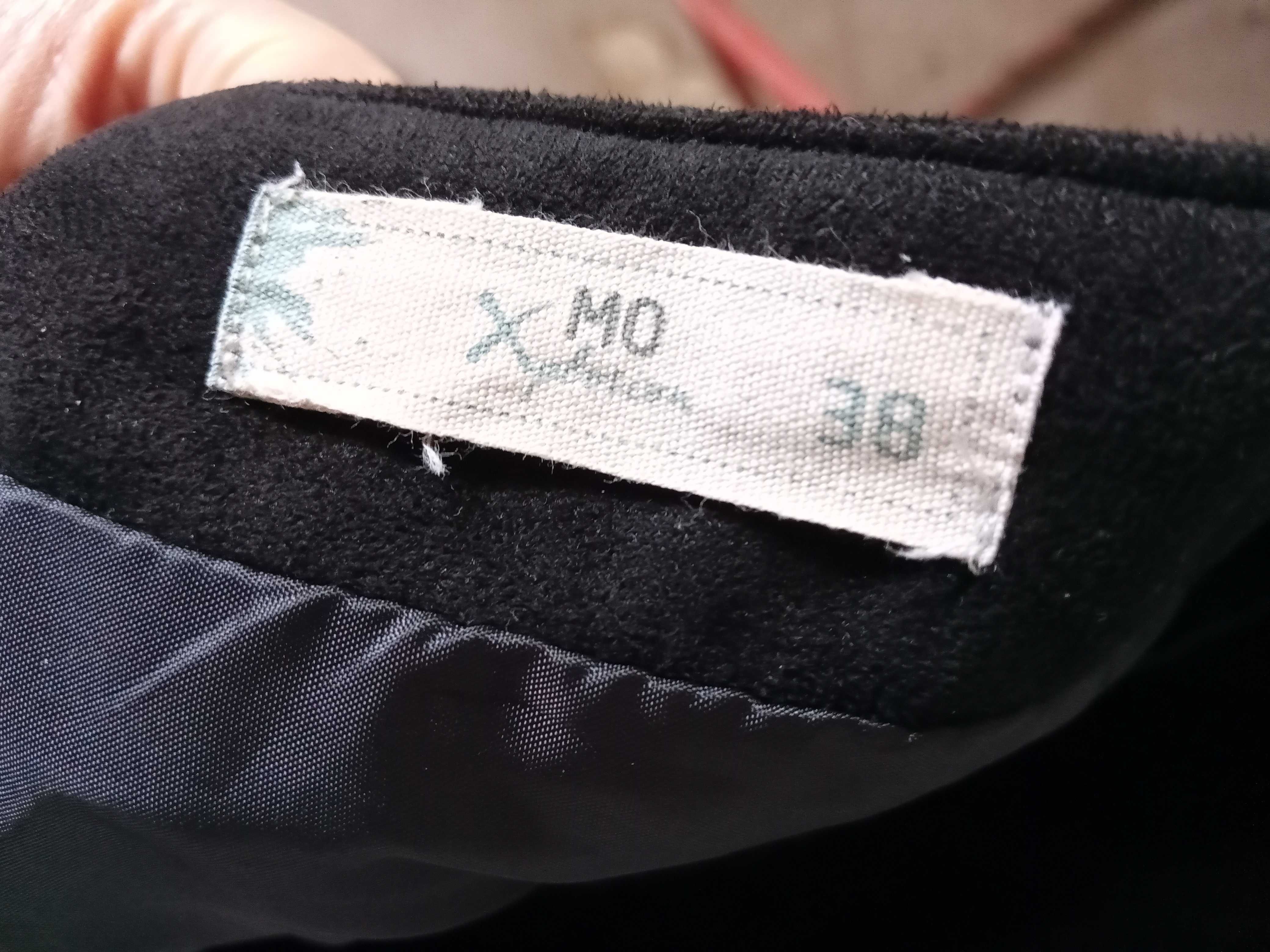 Mini saia preta pele pêssego franjas