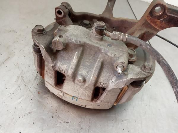 Pinça travão / maxila de travão frente esquerda NISSAN NV200/Evalia Co