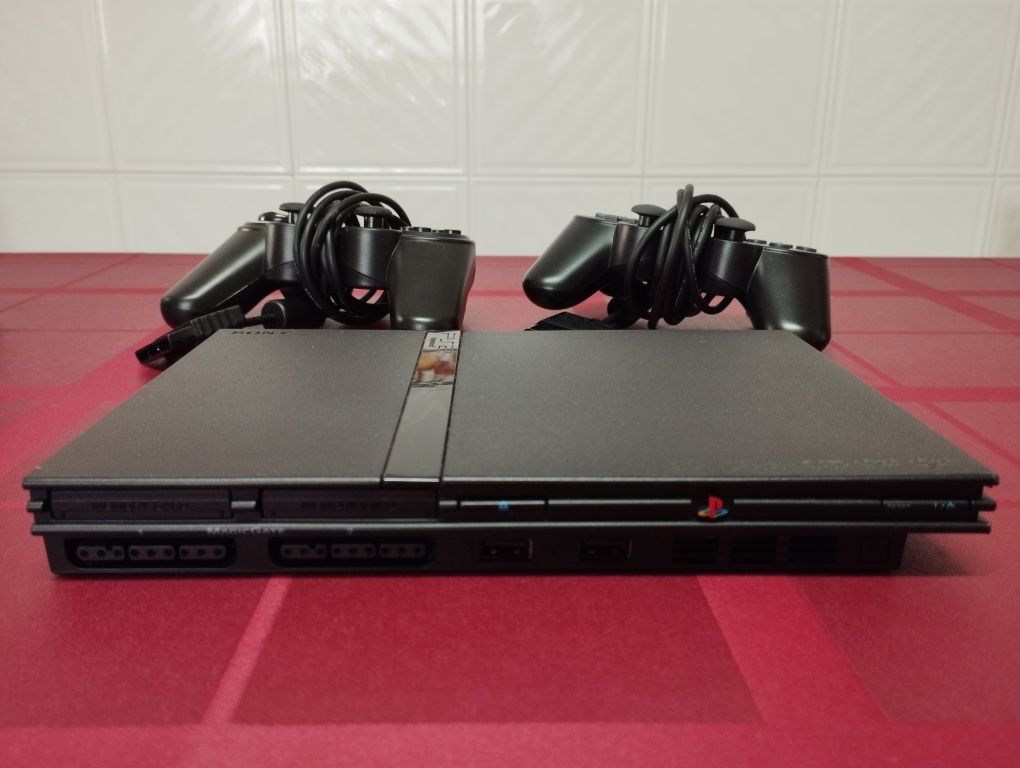 PlayStation 2 Slim + volante + pedais + 16 jogos