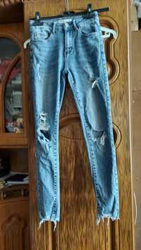 Spodnie jeansowe damskie z dziurami Mi Sara XS.