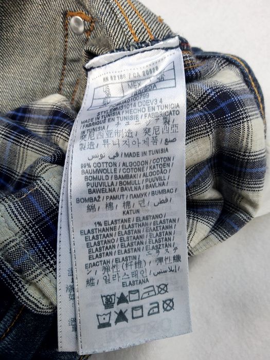 Guess - męskie spodnie jeansowe z dziurami i przetarciami