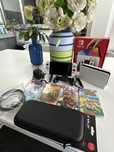 Nintendo Switch OLED + bolsa + 5 jogos
