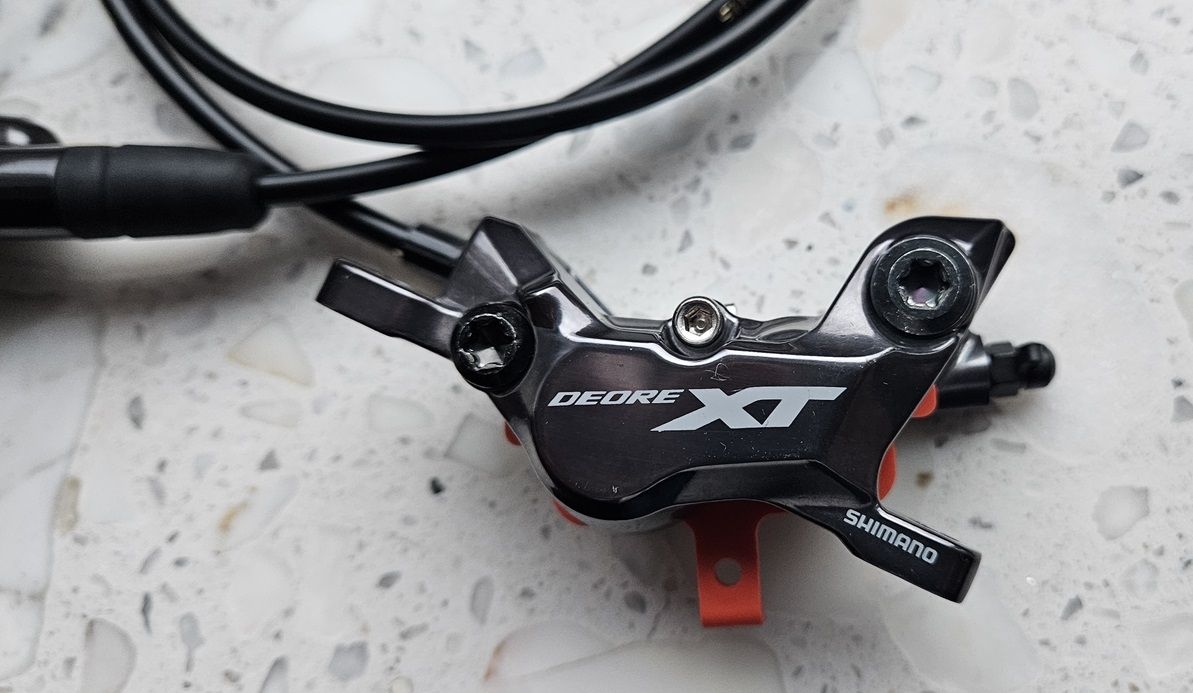 Hamulec tarczowy hydrauliczny Shimano Deore XT M8120 przód OEM
