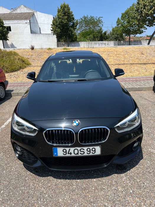 BMW 116 coupé com teto de abrir.