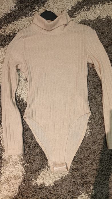 Жіночий ребристий комбінезон з довгим рукавом та високою горловиною