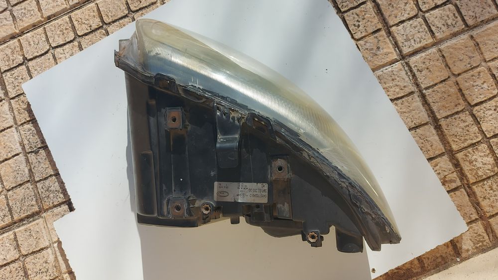 Farol optica dianteira Chrysler Voyager