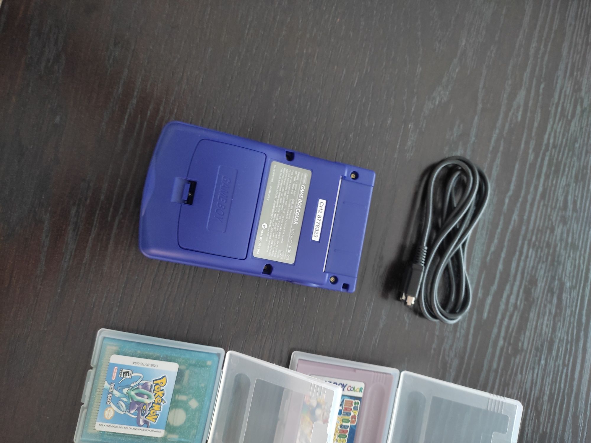 Conjunto Gameboy Color roxo com 8 jogos e cabo link