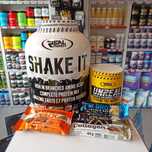 Real Pharm SHAKE IT 2250g Białko + Przedtreningówka UNREAL + GRATISY