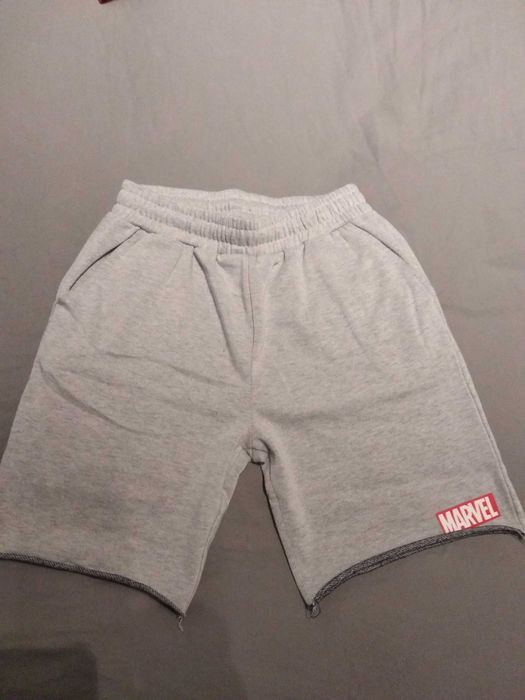 2 pares de calções em malha, tamanho 14 anos