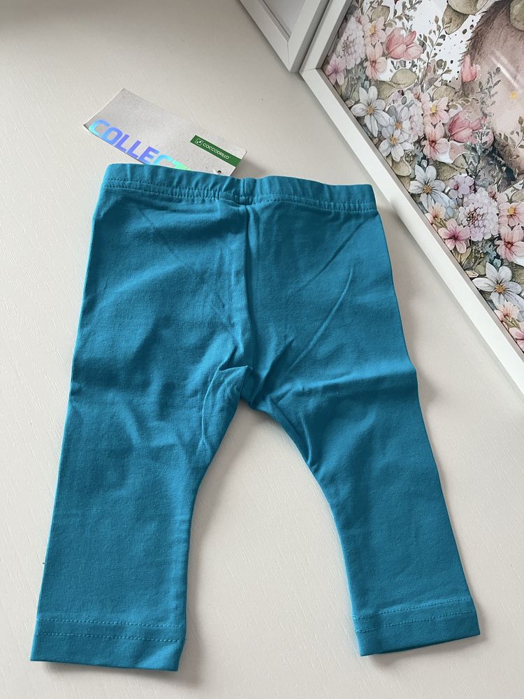 Nowe z metkami niebieskie legginsy ze złotym lampasem Coccodrillo 62