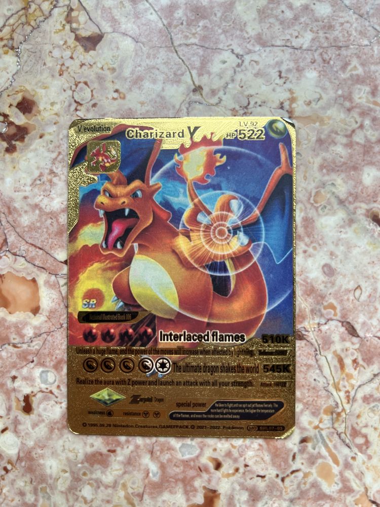 3 zlote karty Pokemon - Pikachu / Charizard + kody to gry