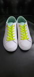 Białe sneakersy Lacoste 34 neon