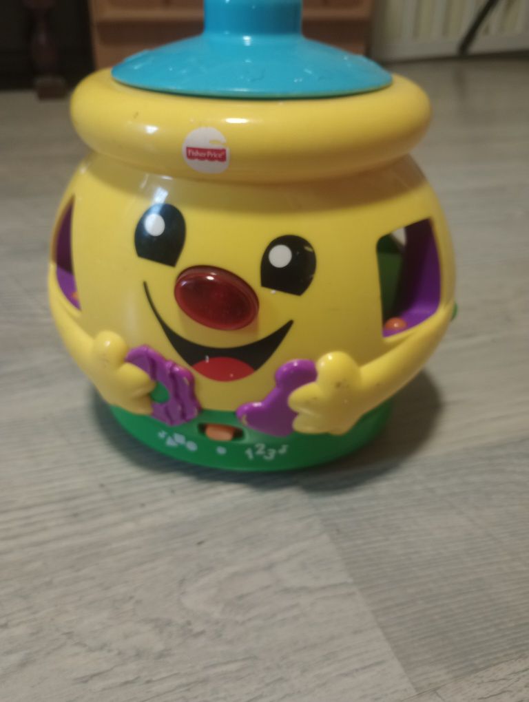 Garnuszek na klocuszek Fischer Price