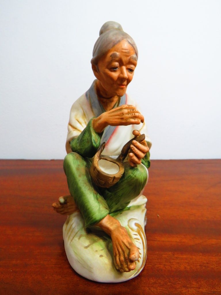 Par de anciãos chineses em cerâmica fina.