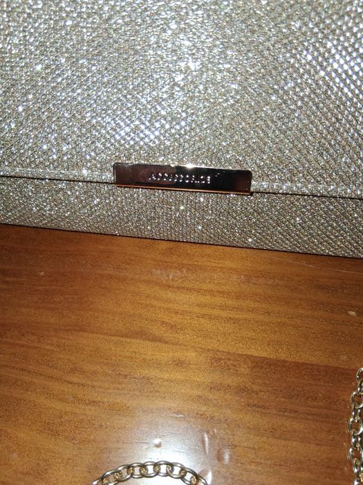 Mala carteira nova com corrente em dourada da marca Accessorize