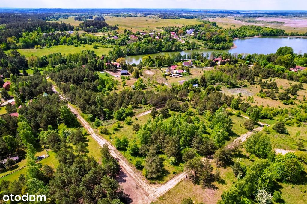 Piękne działki w otoczeniu krzewów z dostępem do jeziora Buwełno