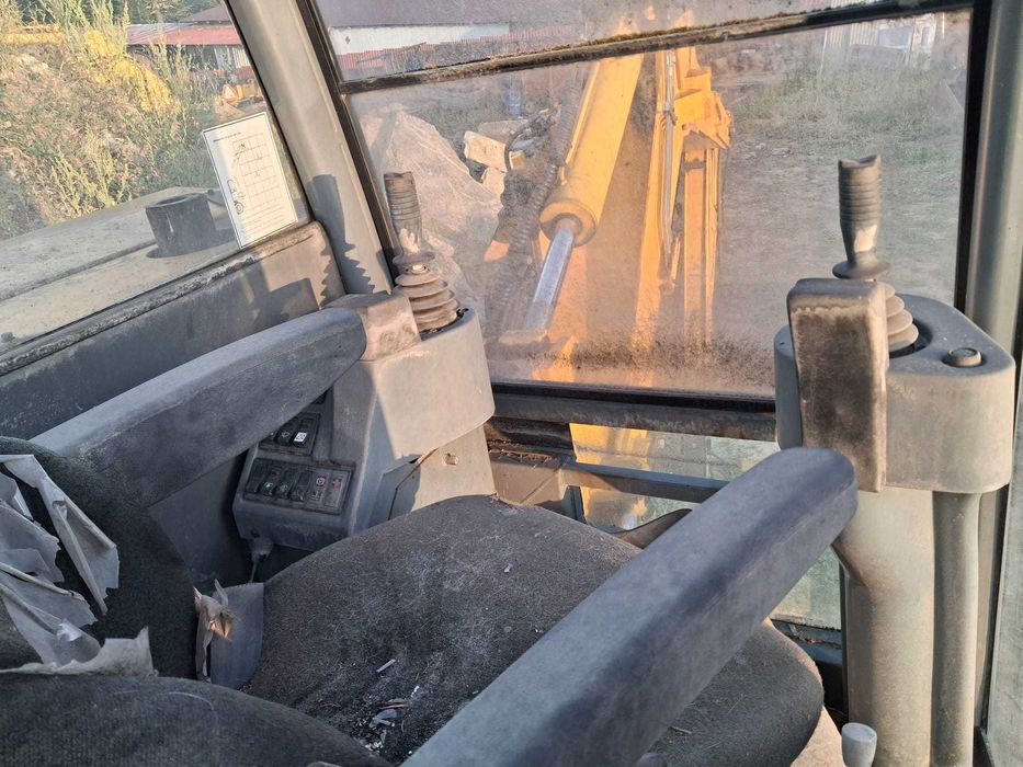 Koparko ładowarka Cat, Case, JCB