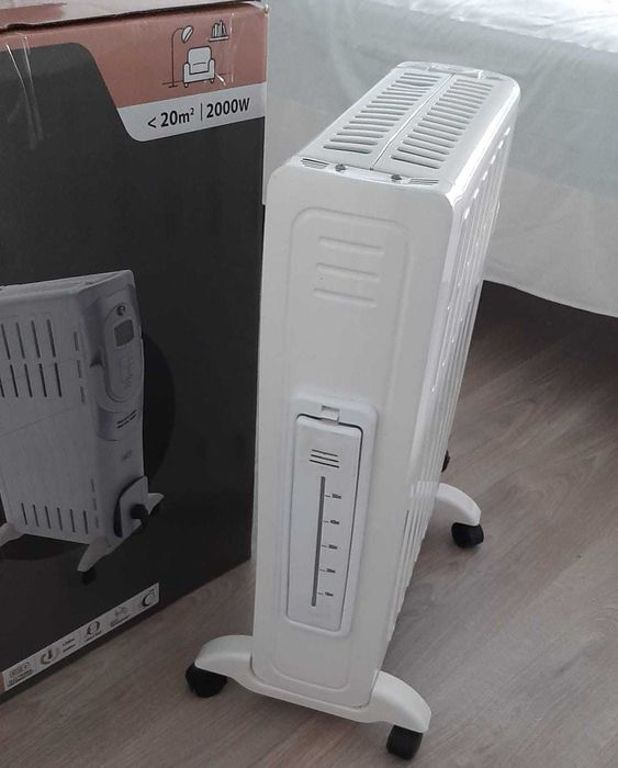 Aquecedor a óleo semi-novo.