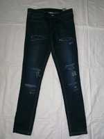 Oryginalne BORN RICH spodnie jeans z dziurami