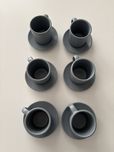Conjunto de chávenas de café e pires