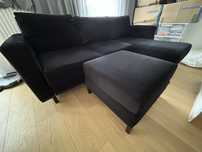 Sofa narożna rozkładana czarna z podnóżkiem