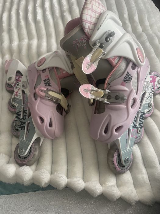 Patins em linha rosa  em bom estado
