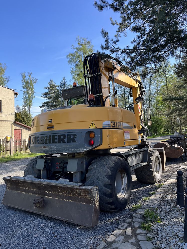 liebherr 312 koparka kołowa z holandii z rotatror