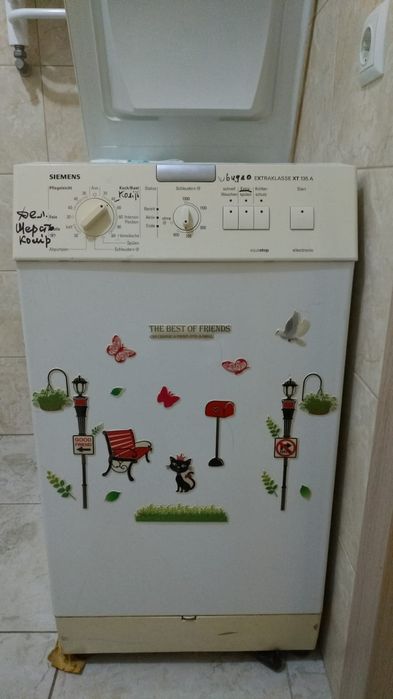 Пральна машина Siemens (вертикальна загрузка)