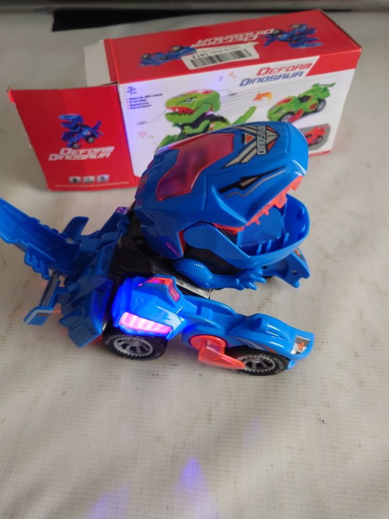 Samochód Dinozaur autko świecące na baterie Transformer wiek 3+