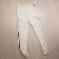 Białe kremowe spodnie czarne zamki rurki sportowe spodnie xs s m