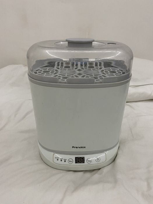 Стерилизатор для 6 бутылок ,сосок,резиновых игрушек.Итальянская фирма