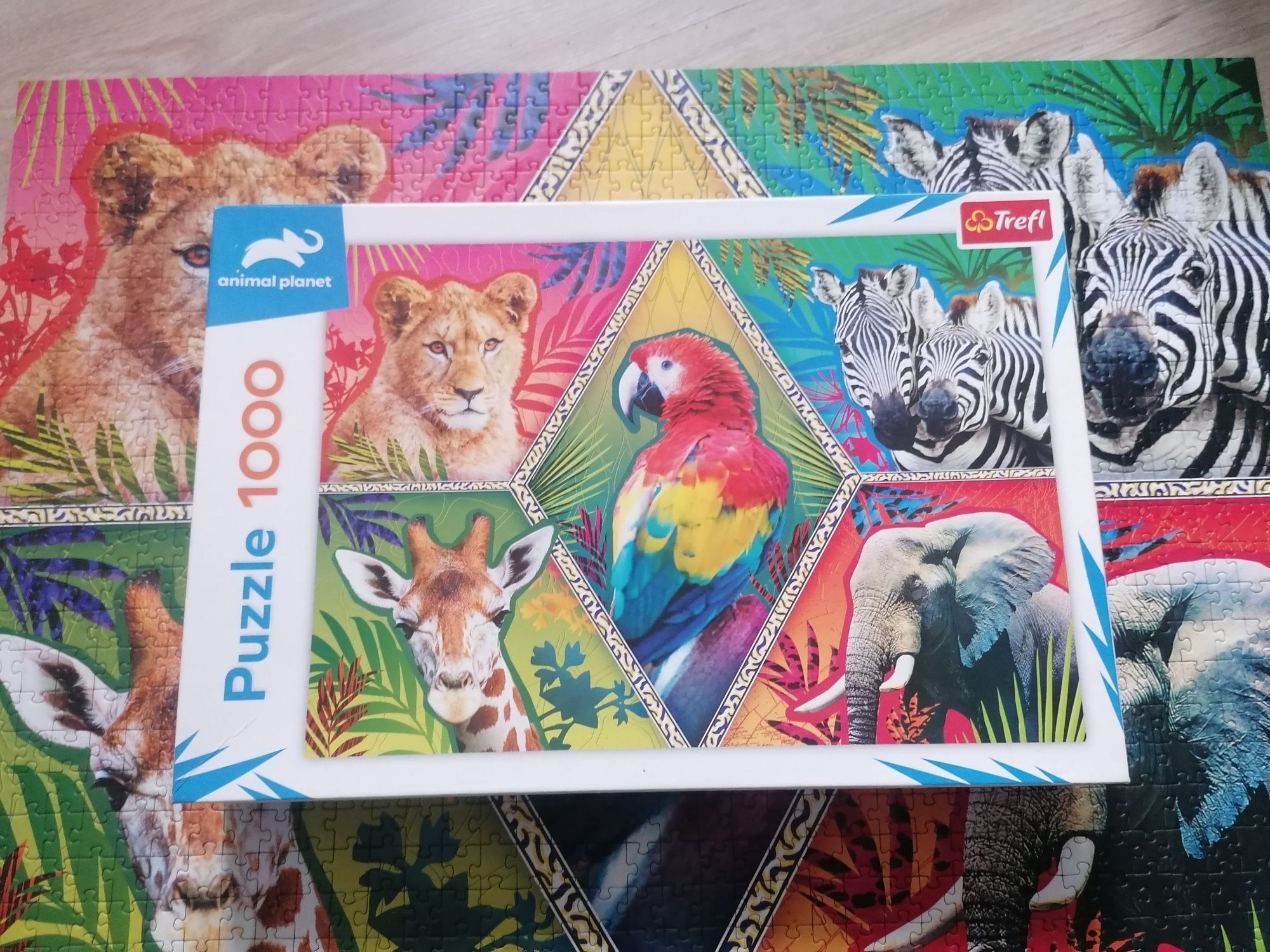 Puzzle 1000 Animal Planet Trefl zwierzęta zebry papuga lew słoń