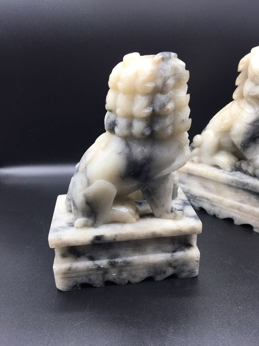 Caes foo orientais em pedra