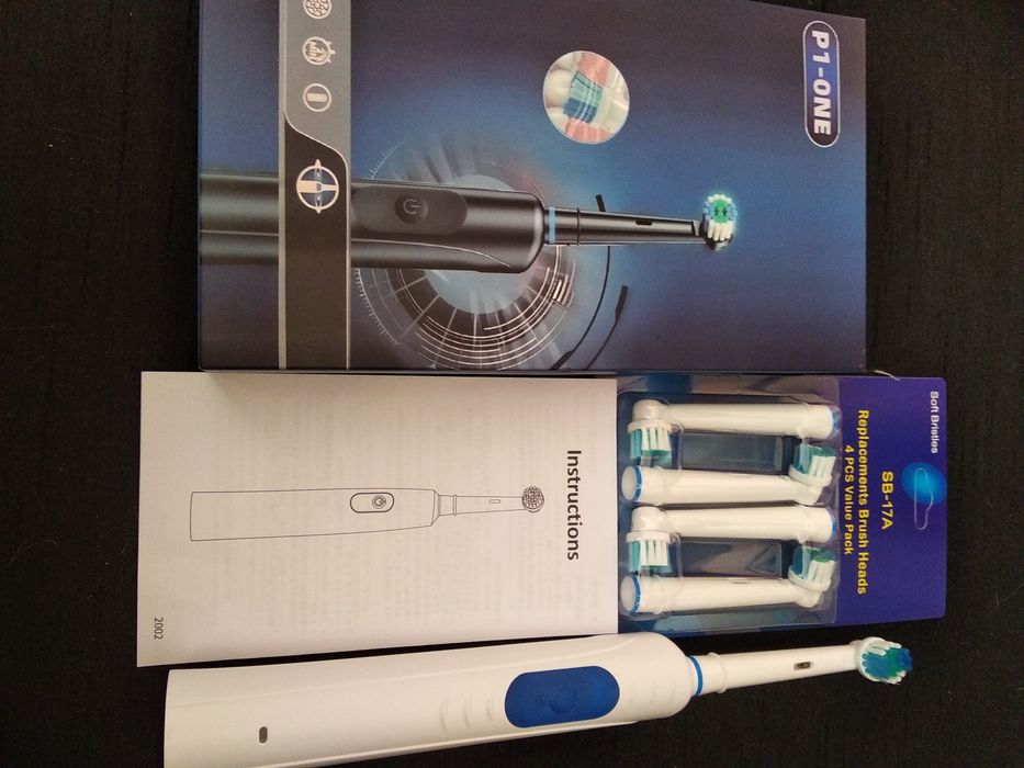 Электрическая зубная щетка