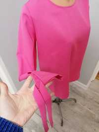 Elegancka różowa bluzka wyjściowa gładka wiązana na rękawach