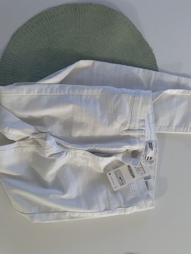 Białe spodnie rurki Sinsay rozmiar 34