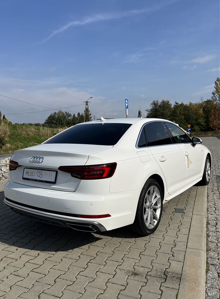 Samochód do ślubu eleganckie białe Audi Sedan A4 S-Line udekorowane