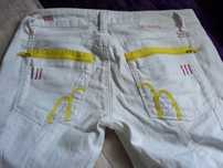 Białe modne spodnie jeans 36